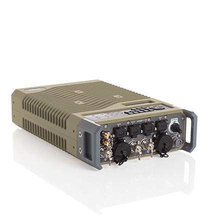 Tan colored Viasat CBM-400 commercial modem, ruggedized form factor, left angle